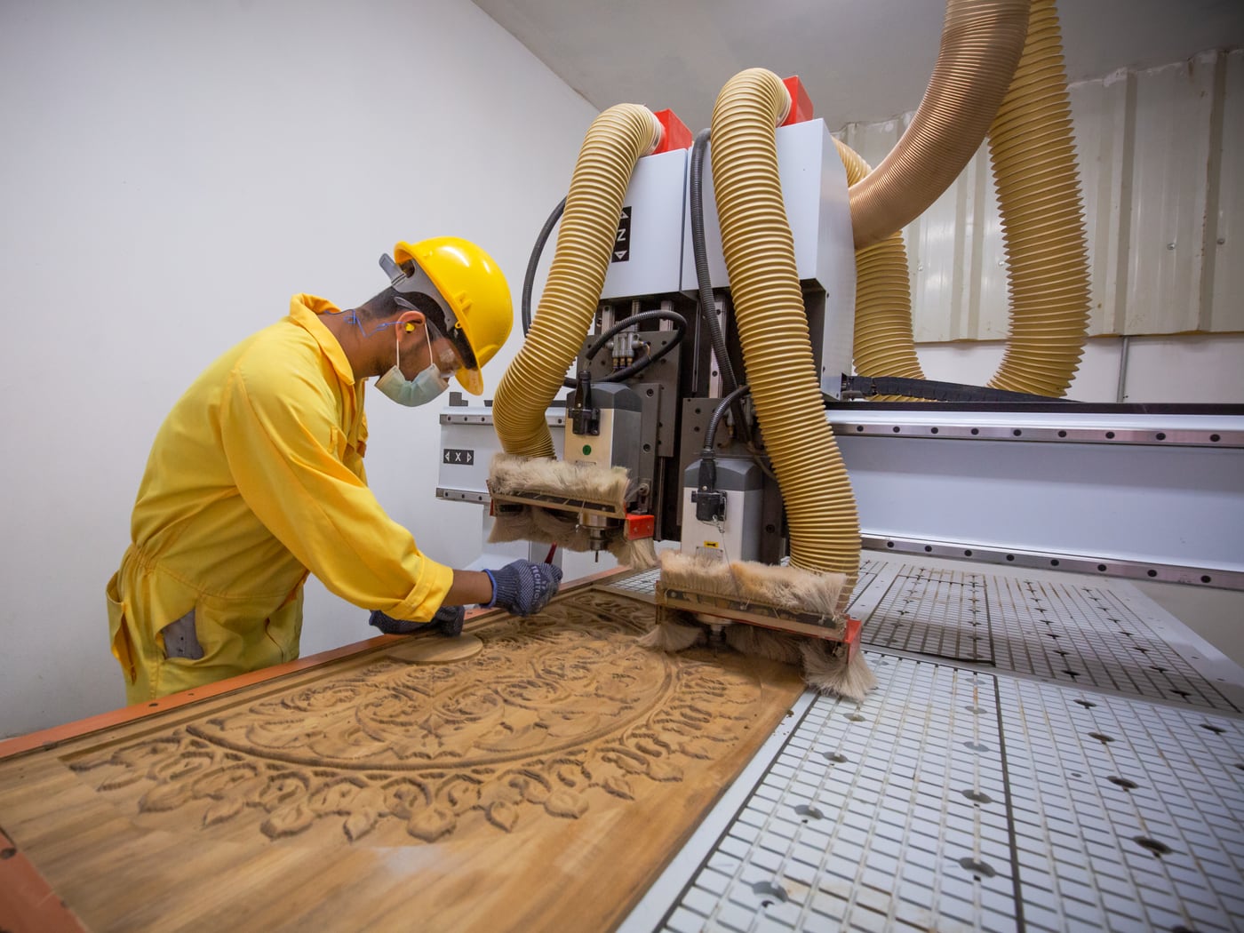 A CNC router running with its dust extraction — the control is part of the machine